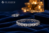 Men's platinum diamond link bracelet displayed on midnight-navy velvet for Platizem.