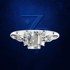 Emerald Cut Diamond Ring with Marquise and Round Cluster Side Stones