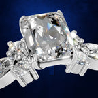 Emerald Cut Diamond Ring with Marquise and Round Cluster Side Stones