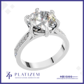 Round Cut Diamond Solitaire Ring Held by a Six Prong Cathedral Setting