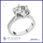 Round Cut Diamond Solitaire Ring Held by a Six Prong Cathedral Setting