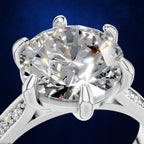 Round Cut Diamond Solitaire Ring Held by a Six Prong Cathedral Setting