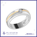 A two-tone wedding band ring featuring a polished silver body, a yellow gold channel accent, and a single round-cut clear gemstone in a bezel setting. The ring is displayed on a white background with a blue border, with the brand name 'PLATIZEM' printed at the bottom.