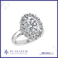 Oval Cut Diamond Halo Ring Encircled by Sparkling Round Accent Stones
