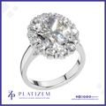 Oval Cut Diamond Halo Ring Encircled by Sparkling Round Accent Stones