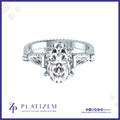 Oval Center Diamond Ring Flanked by Tapered Baguettes