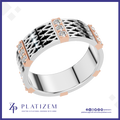 A platinum and rose gold ring with a geometric openwork pattern, accented with rows of clear cubic zirconia stones. The brand logo 'PLATIZEM' is visible at the bottom.