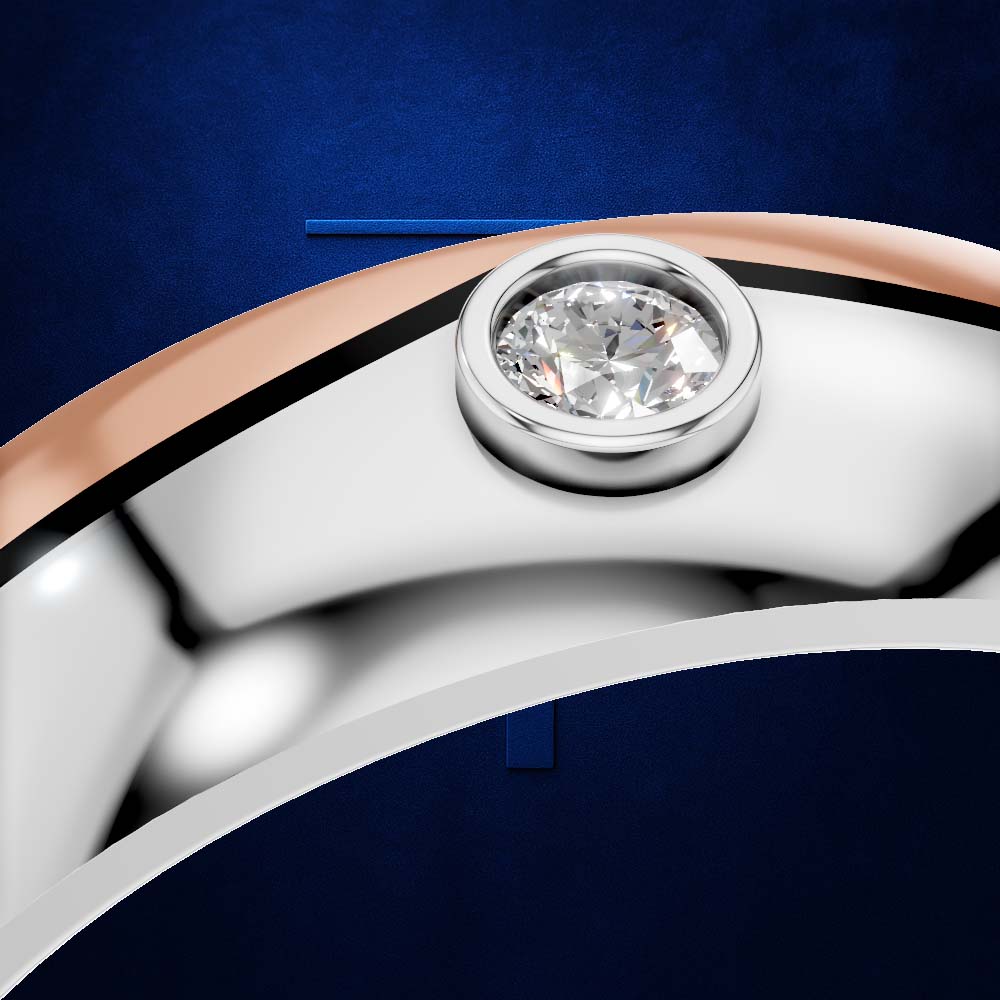 Close-up of a ring band with a round clear gemstone in a polished silver bezel, set against a deep blue textured background.