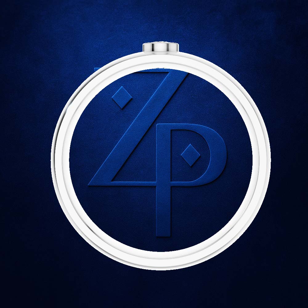 A circular silver-toned pendant or medallion with a deep blue center featuring an embossed stylized 'ZP' monogram, shown against a textured dark blue background.