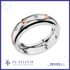 A polished two-tone wedding band ring by Platiszem, featuring a silver-toned main body, rose gold chevron accents, and small clear pavé-set diamonds. The ring is displayed on a white background with a blue border, and the Platiszem brand logo is visible at the bottom.