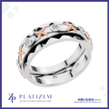 A platinum and rose gold ring with a geometric pattern and small clear gemstones, shown on a white background with the brand logo 'PLATIZEM' at the bottom.
