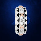 A geometric diamond band ring featuring a silver-toned body with black triangular inlays, rose gold 'X' accents, and three round-cut diamonds, set against a dark blue textured background.