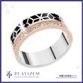 A men's modern ring by Platiszem, featuring a silver band with a black geometric pattern, a rose gold inlay with a row of clear cubic zirconia stones, and a polished silver base. The ring is displayed on a white background with a blue border and the Platiszem brand logo at the bottom.