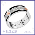A platinum band ring with a silver-colored center channel paved with clear stones, bordered by thick black inlays and accented with rose gold diamond-shaped side stones. The brand logo 'PLATIZEM' is visible at the bottom.