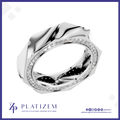 A polished silver-toned ring with a sculptural, faceted geometric design and a single row of clear pavé-set stones around the band, shown on a white background with the Platizem brand logo at the bottom.
