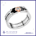 A silver-toned double-band ring with a rose gold accent and a central clear gemstone, shown on a white background with the brand name PLATIZEM at the bottom.