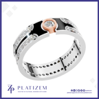 A silver-toned double-band ring with a rose gold accent and a central clear gemstone, shown on a white background with the brand name PLATIZEM at the bottom.