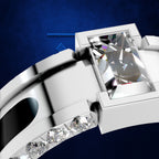 A close-up studio render of a silver-toned ring with a large rectangular clear gemstone and smaller clear stones along the band, set against a deep blue background.