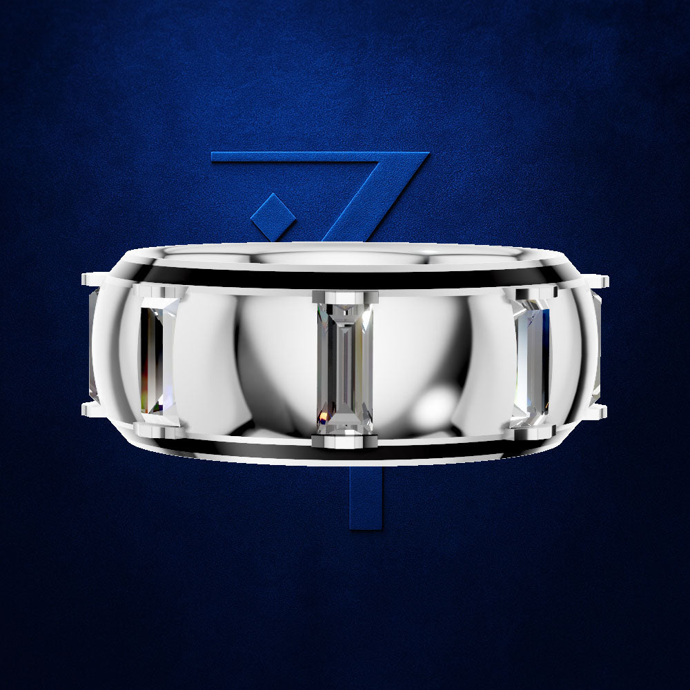 A silver-toned cylindrical watch band or ring-like accessory with rectangular clear crystal elements, centered on a dark blue textured background with a stylized blue number 7 behind it.