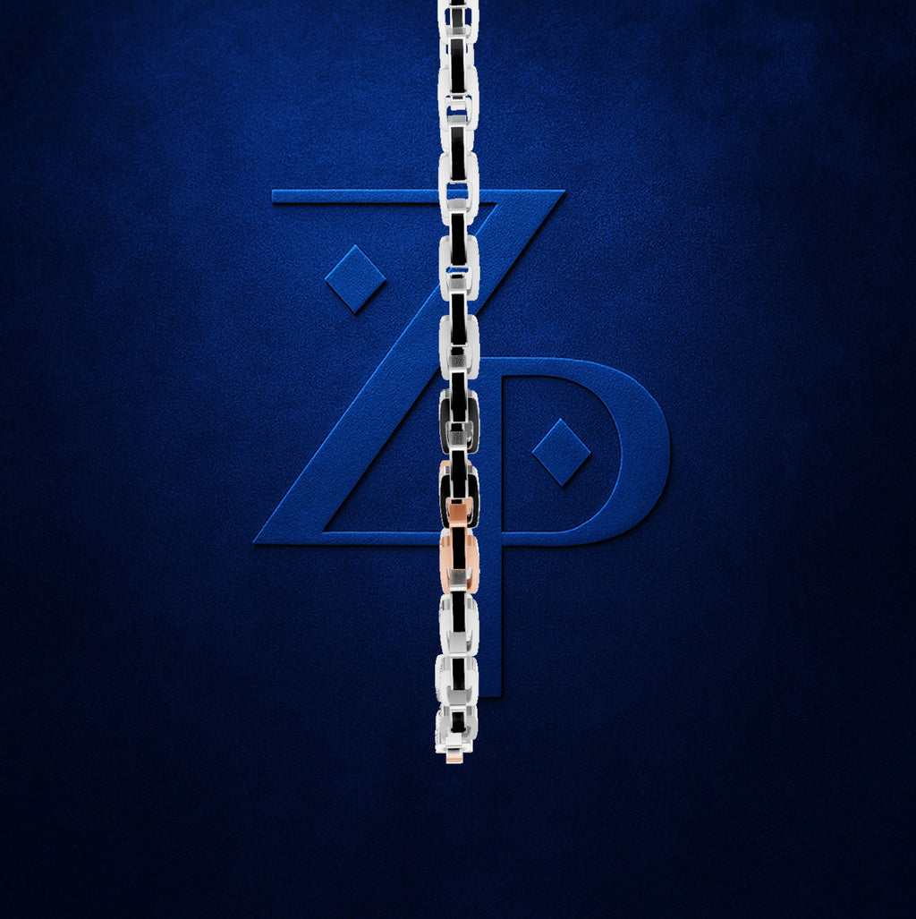 A close-up of a metallic link chain hanging vertically in front of a dark blue textured background, with a large stylized blue 'ZP' monogram behind it.