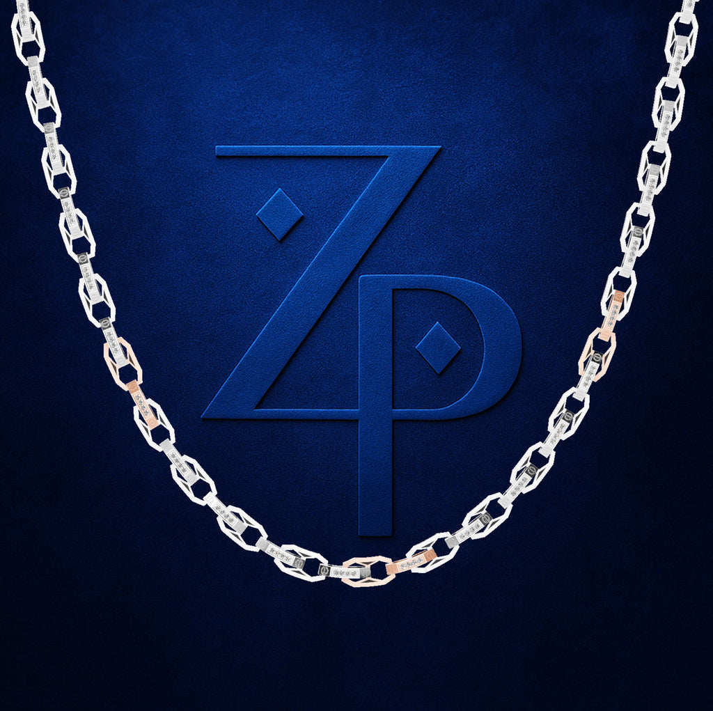A silver-toned chain necklace draped in an arch over a dark blue textured background, with a large embossed stylized 'ZP' logo centered behind it.