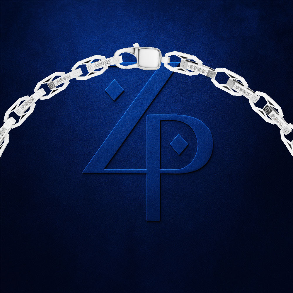 A silver chain necklace draped in an arch over a dark blue textured background, with a large embossed blue monogram logo beneath it.