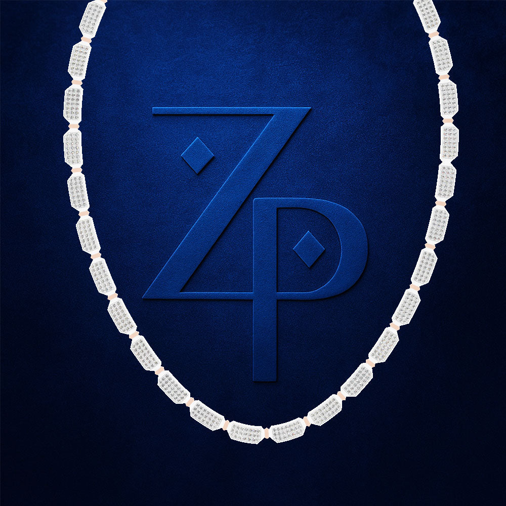 A white diamond necklace arranged in an oval shape against a textured dark blue background, framing a large embossed 'ZP' monogram logo.
