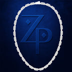 A white diamond necklace arranged in an oval shape against a textured dark blue background, framing a large embossed blue 'ZP' monogram.