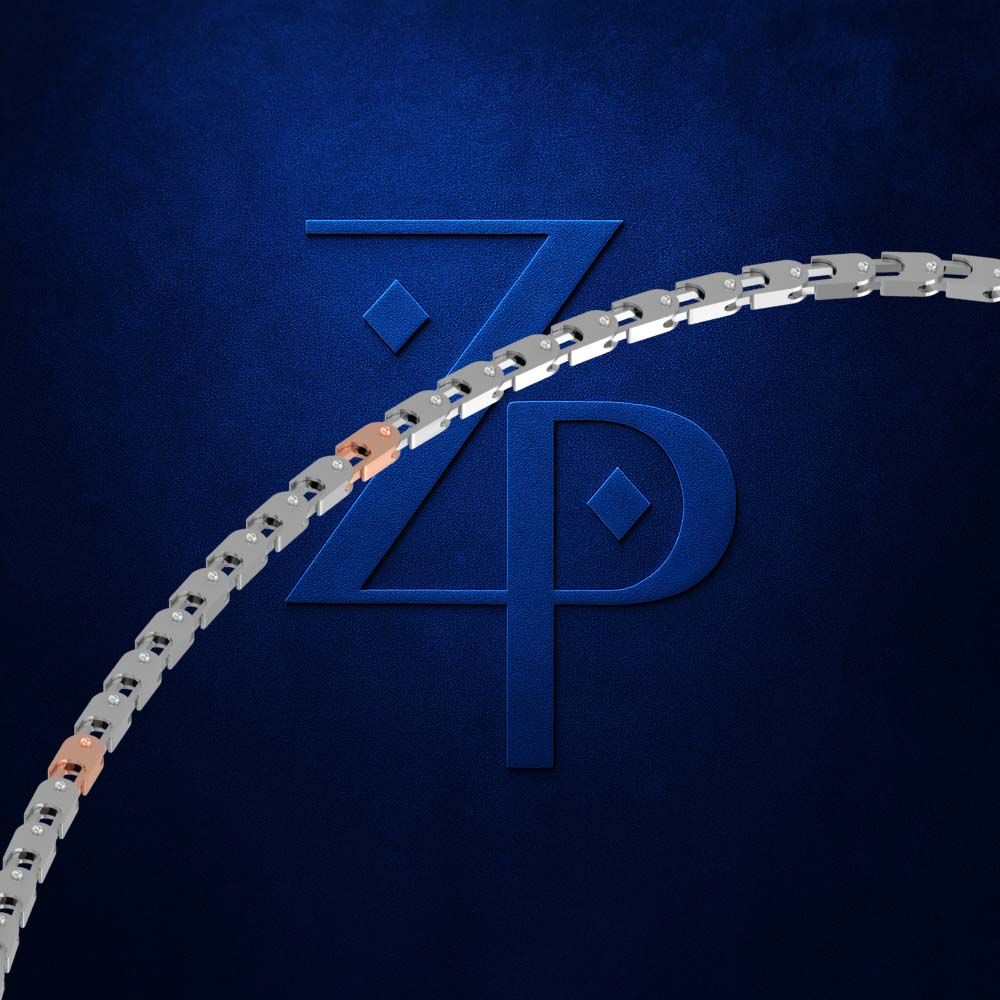 A close-up of a silver-toned metal chain with a few rose-gold links, set against a dark textured blue background with a large embossed stylized 'ZP' logo.