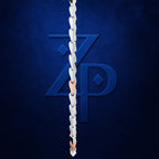 A close-up of a silver chain link necklace draped vertically in front of a dark blue textured background with a large stylized 'ZP' logo.