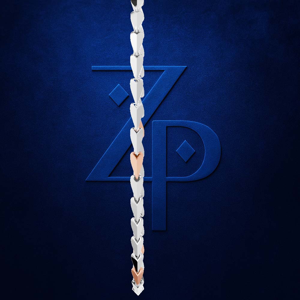 A close-up of a silver chain link necklace draped vertically in front of a dark blue textured background with a large stylized 'ZP' logo.