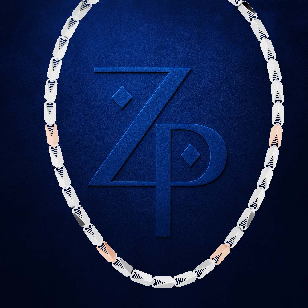 A necklace composed of alternating silver and rose gold oval links, arranged in an oval shape around a large embossed blue 'ZP' logo on a textured dark blue background.