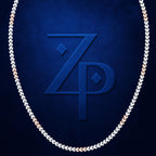A close-up of a chain necklace with alternating silver and rose gold links, arranged in an oval shape against a textured dark blue background. A large embossed 'ZP' monogram is visible in the center.