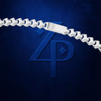 A close-up of a silver chain necklace with a rectangular clasp, shown against a dark textured blue background with a large embossed stylized 'ZP' logo.