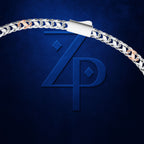 A close-up of a silver chain bracelet with a white paper clip clasp, set against a dark textured blue background with a large embossed 'ZP' logo.