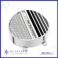 A round silver-toned jewelry setting or ring base with a split design: one half encrusted with clear stones and the other half featuring black diagonal stripes, shown on a white background with the Platizem brand logo at the bottom.