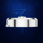 A polished silver metallic watch band or bracelet component shown from the side against a textured dark blue background, with a stylized blue 'Z' logo behind it.