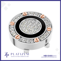 A round silver-toned jewelry component or decorative piece featuring a black circular band, a central cluster of clear stones, and a surrounding ring of clear stones with rose gold screw accents, shown on a white background with the brand name PLATIZEM at the bottom.