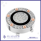 A round silver-toned jewelry component or decorative piece featuring a black circular band, a central cluster of clear stones, and a surrounding ring of clear stones with rose gold screw accents, shown on a white background with the brand name PLATIZEM at the bottom.