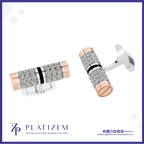 A pair of rectangular cufflinks by Platizem, featuring a silver-toned pavé-set crystal center with a polished rose gold end cap and a thin black accent band. One cufflink is shown from a side angle and the other from a three-quarter angle, set against a white background with a blue border and the Platizem brand logo at the bottom.