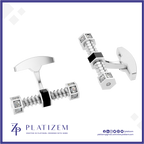 A pair of silver-toned men's cufflinks by Platizem, featuring a wing-shaped back and screw-like front sections adorned with small clear gemstones and black square accents, shown on a white background with the Platizem brand logo at the bottom.