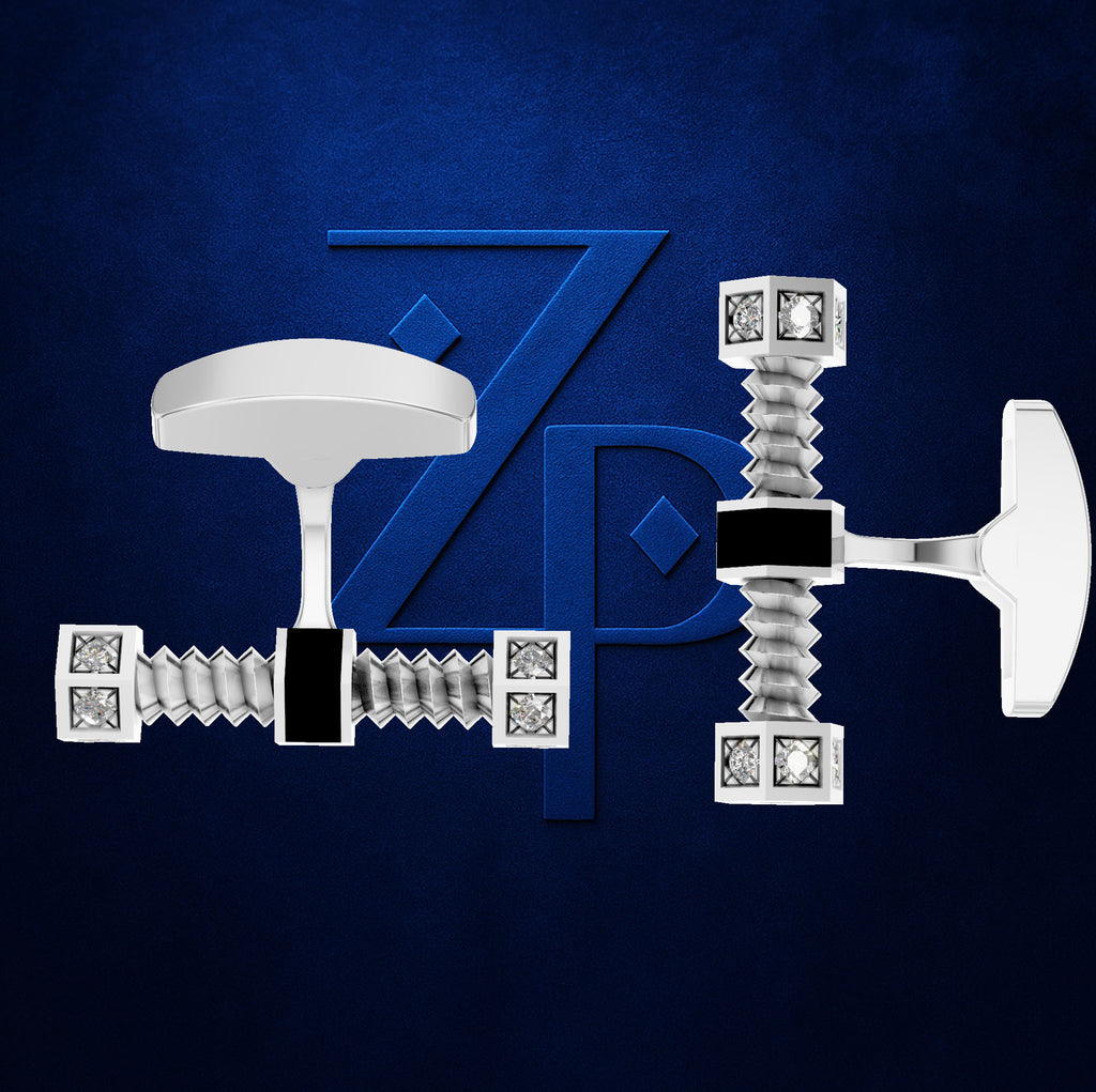 A pair of silver-toned cufflinks with a unique screwdriver-inspired design, featuring rhinestone-embellished squares and a black accent bar, displayed against a dark blue textured background with a subtle metallic 'ZP' logo.