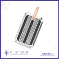 A rectangular dog tag pendant with a polished silver-tone border, two vertical black inlay stripes, and two rows of clear rhinestones. A rose gold-tone loop is attached at the top.