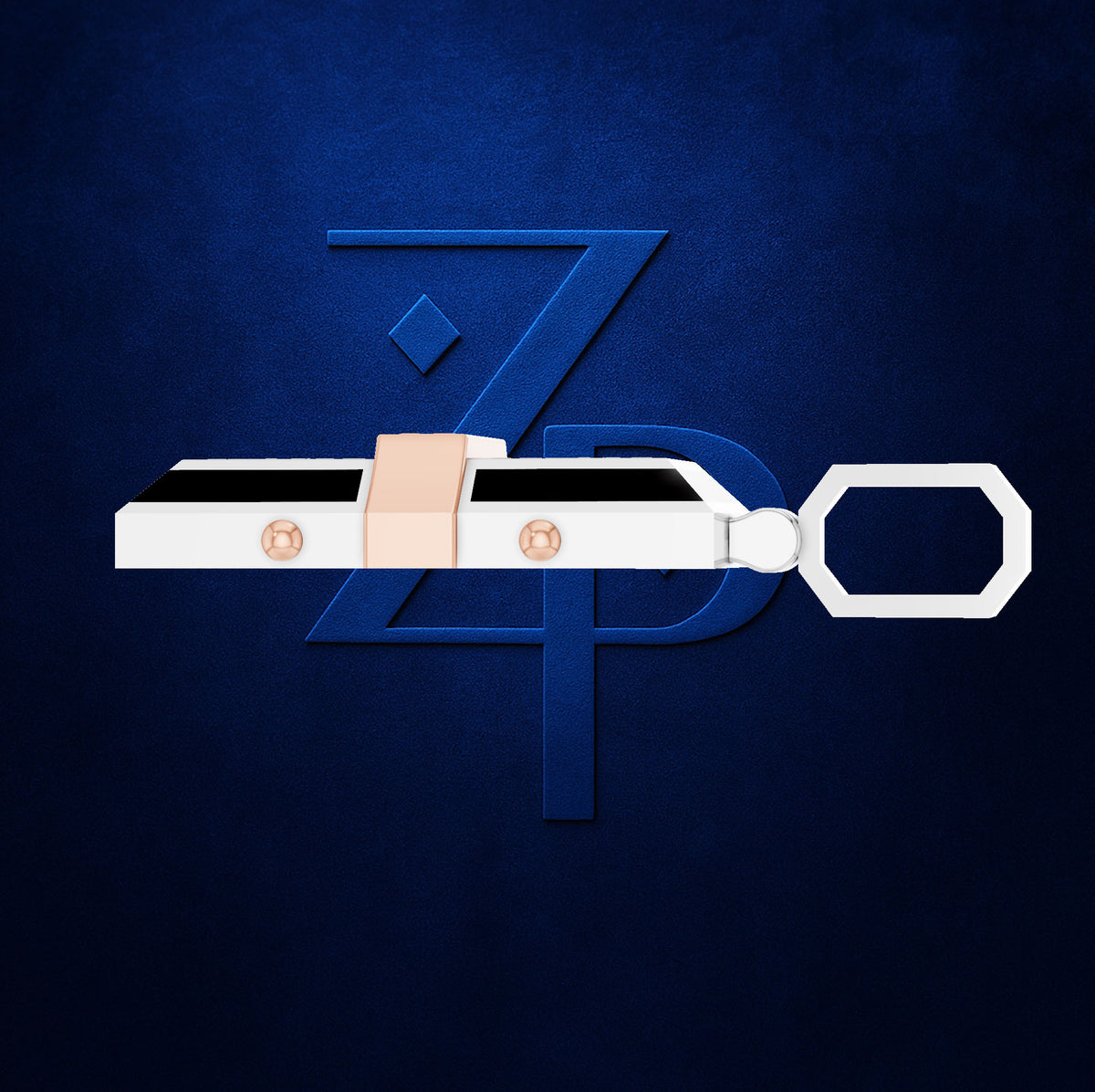 A white and black rectangular keychain or fob with a peach-colored loop and two small metallic circular details, shown against a dark blue textured background with a large stylized blue letter Z behind it.