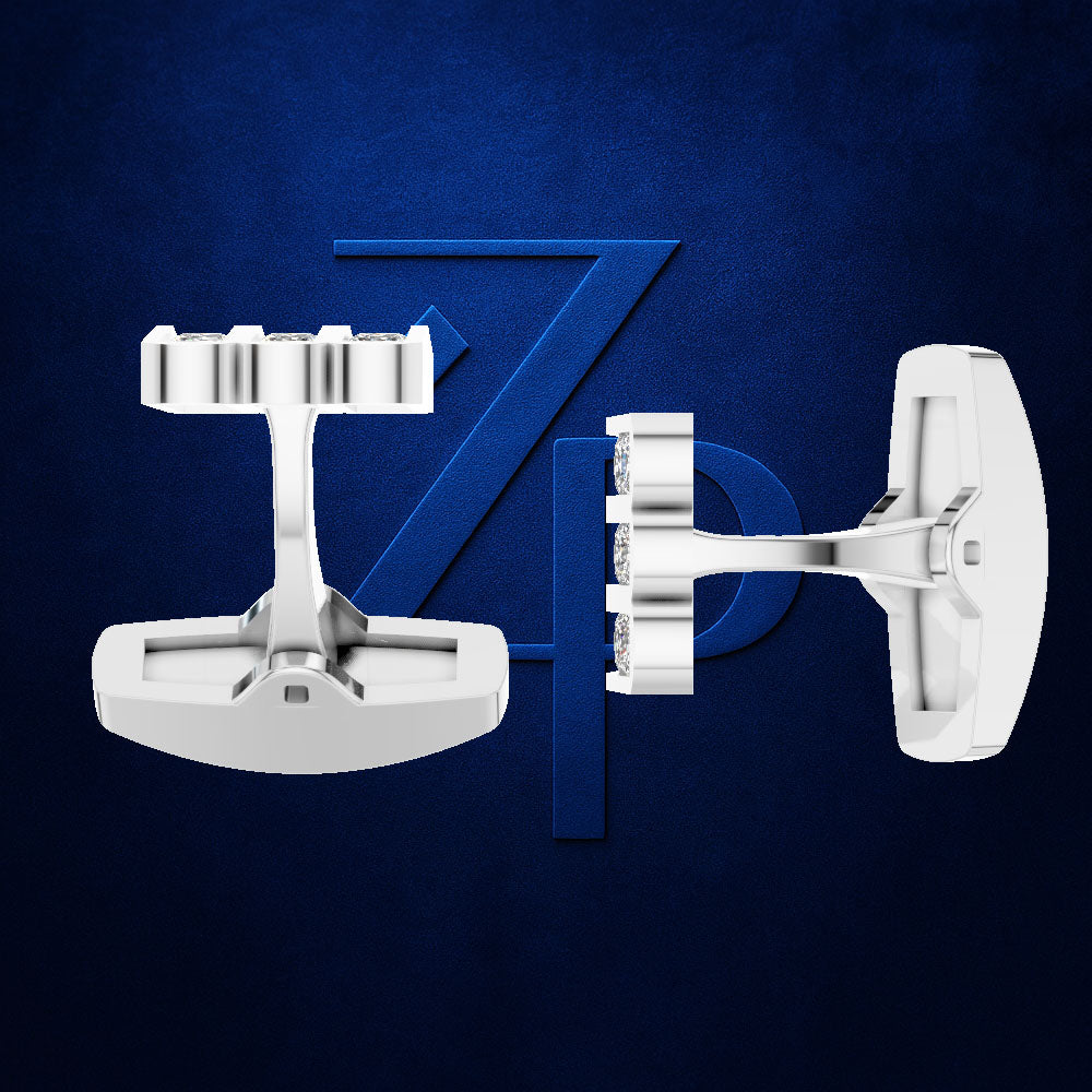 A pair of white men's cufflinks displayed against a textured dark blue background with a stylized blue 'ZP' logo behind them.