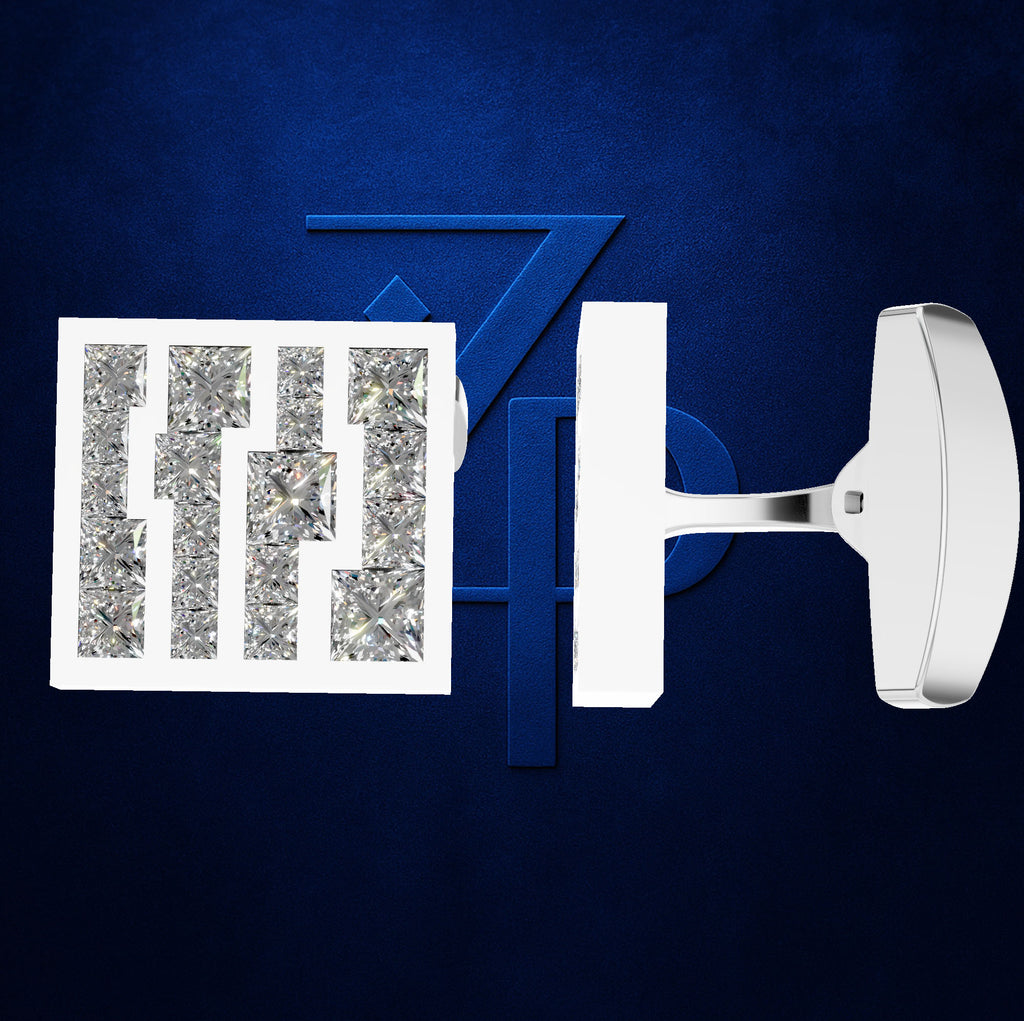A pair of white men's cufflinks with clear crystal inlay lettering, displayed on a textured dark blue background with a matching blue 'Z' accent.