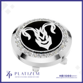 A round silver-toned golf hole flag stop with a black center featuring a white ram head emblem, surrounded by a halo of clear crystals. The brand name 'PLATIZEM' is visible at the bottom of the image.