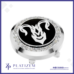 A round silver-toned golf hole flag stop with a black center featuring a white ram head emblem, surrounded by a halo of clear crystals. The brand name 'PLATIZEM' is visible at the bottom of the image.