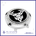 A round golf ball marker cap featuring a polished silver-tone metal bezel set with clear crystals, a black center, and a white deer head logo. The brand name 'PLATIZEM' is visible at the bottom of the image.