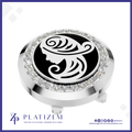 A round silver-toned golf club headcover with a black center featuring a white stylized female profile design, surrounded by a border of clear rhinestones. The brand name 'PLATIZEM' is visible at the bottom of the image.